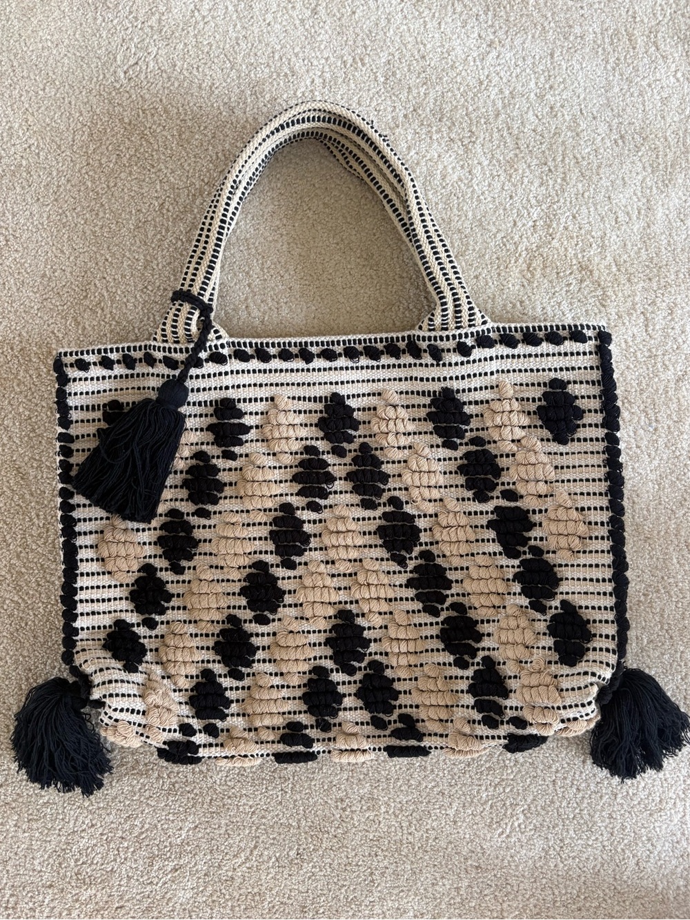 Woven Black and Cream Chic Tote Bag with Tassel Accents